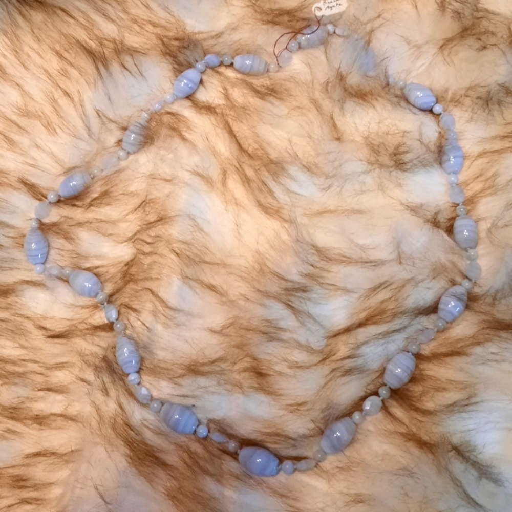 31 inch long Blue Lace Agate hand-knotted necklace.